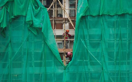 Hong Kong races to remove scaffolding nets blamed for fueling deadly fire