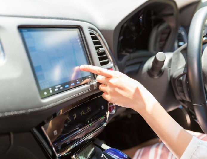 Why do female voices dominate automated guidance in Japan?