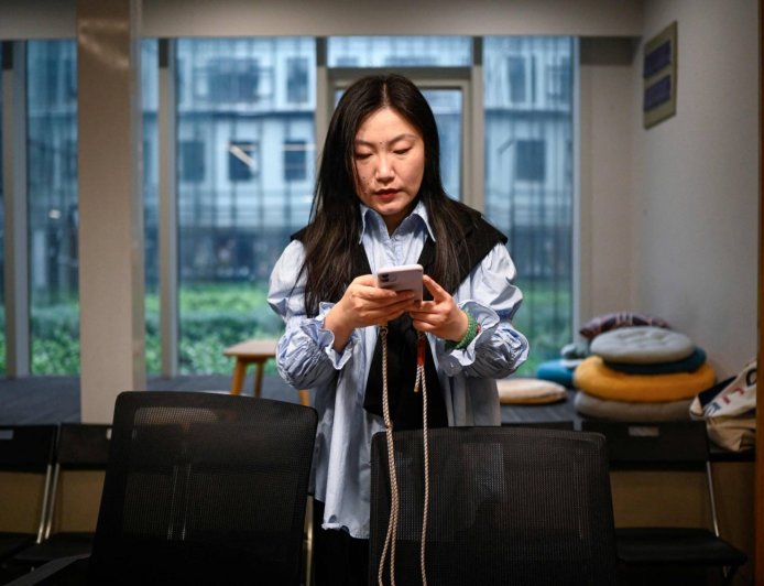 Young Chinese use AI to launch one-person firms over job anxiety